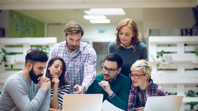 RMS dashboards for small businesses, showing payroll, attendance, and onboarding modules on mobile and desktop group of people with laptop
